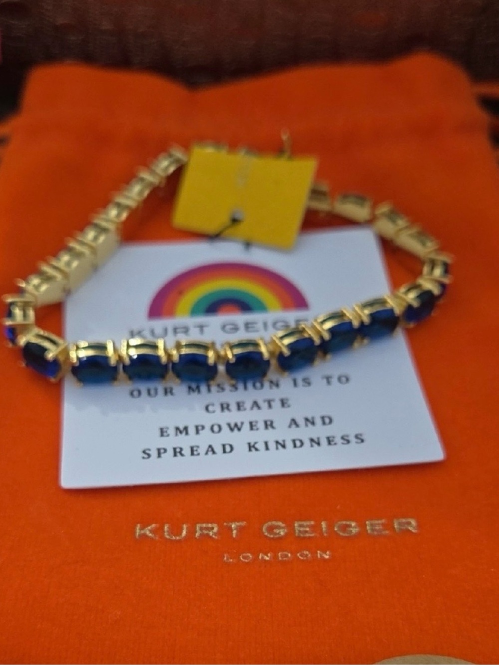 kurt geiger gold and blue link bracelet